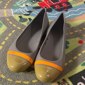CROCS Gray Flats with Glossy Yellow and Orange Trim